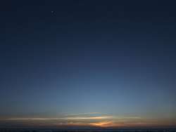 Moon and Approaching Freighter