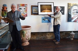 08 Auctioneer Stephen Battrick doing what he does best-with Chris de Jong and the photograph "Silo" which went for $38